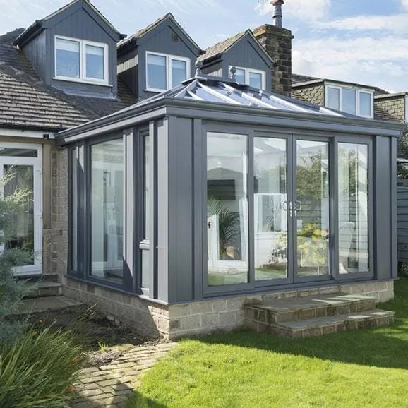 Grey-framed glazed extension with a solid roof