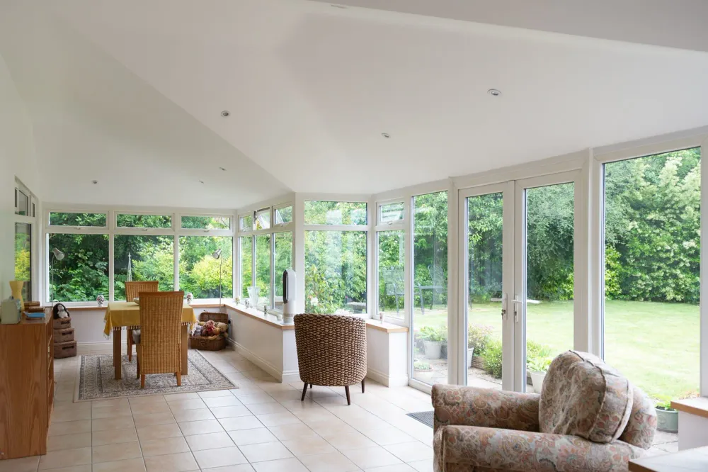 Bright conservatory interior after a solid insulated roof replacement