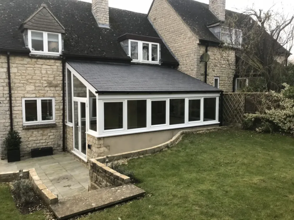 Replacement solid conservatory roof on a stone home